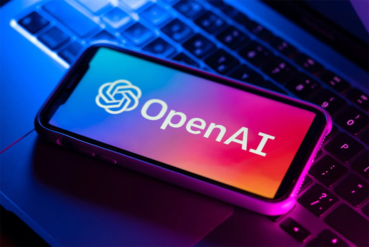 OpenAI logo displayed on smartphone screen representing ChatGPT advertising and AI marketing